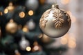 a christmas ornament with gold and silver decorations hanging from a christmas tree Royalty Free Stock Photo