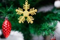 Christmas Ornament With gold Snowflakes, red pine cone, Merry Christmas and Happy New Year