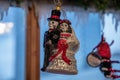 Christmas ornament in shape of wedding couple of skeletons bride and groom. Halloween scull decor. Christmas ornament closeup