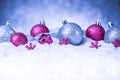 Christmas ornament in snow on glitter background Royalty Free Stock Photo