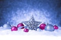 Christmas ornament in snow on glitter background Royalty Free Stock Photo