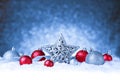 Christmas ornament in snow on glitter background Royalty Free Stock Photo