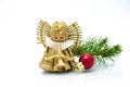 Christmas ornaments, angel christmas tree ornament and green holly Royalty Free Stock Photo