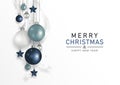 Christmas ornaments. Christmas ball dark blue, light blue, and white balls, decoration with stars and ribbon hanging on white. Royalty Free Stock Photo