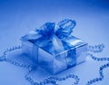 Christmas Ornaments. Blue gift box. Royalty Free Stock Photo