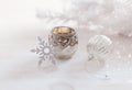 Christmas ornaments and candle over white background Royalty Free Stock Photo