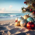 Christmas ornaments and decorations in the sand on the beach on a bright sunny day. Happy New Year and Merry Christmas holidays