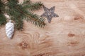 Christmas ornaments and fir tree branch on a rustic wooden background. Xmas card. Happy New Year. Top view Royalty Free Stock Photo