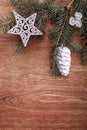 Christmas ornaments and fir tree branch on a rustic wooden background. Xmas card. Happy New Year. Top view Royalty Free Stock Photo