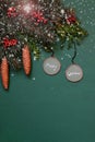 Christmas ornaments, fir tree branches, cones on green background with painted snow.Vertical. Flat lay Royalty Free Stock Photo