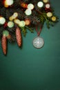 Christmas ornaments, fir tree branches, cones on green background with red berries.Vertical.Flat lay. Copy space Royalty Free Stock Photo