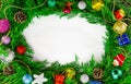 Christmas ornaments on fir tree branches isolated on white background. Decorated for New Year and Christmas. Circle frame Royalty Free Stock Photo