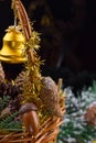 Christmas ornaments with garland of beads, pine cones and acorns laying in a basket Royalty Free Stock Photo