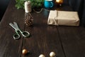 Christmas ornaments gift boxes wooden table. Rustic Christmas background. Wrapping presents background Royalty Free Stock Photo