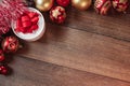 Christmas ornaments and gifts on a wooden table. Holidays christmas background. Copy space for text or design. View from above Royalty Free Stock Photo