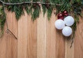 Christmas ornaments on hard wood background with green top frame