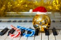 Christmas ornaments near the piano. Music on New Year`s Eve_ Royalty Free Stock Photo