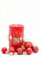 Christmas ornaments - red candle and red and gold ornaments Royalty Free Stock Photo