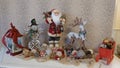 Christmas ornaments on a shelf - Santa Claus, Rudolph the reindeer, Frosty the snowman Royalty Free Stock Photo