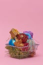 Christmas ornaments in a shopping basket Royalty Free Stock Photo