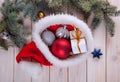 Christmas ornaments on a table in the snow with nice festive background Xmas illuminations