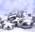 Christmas ornaments on a table in the snow with nice festive background Xmas illuminations