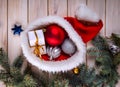 Christmas ornaments on a table in the snow with nice festive background Xmas illuminations