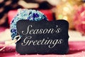 Christmas ornaments and text seasons greetings