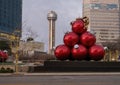 Christmas Ornaments, trees with lights, and the iconic Reunion Tower in downtown Dallas, Texas. Royalty Free Stock Photo