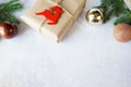 Christmas paper gift box with decorations deer and balls on gray background, copy space Royalty Free Stock Photo