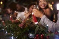 Christmas party at a bar, focus on foreground decorations Royalty Free Stock Photo