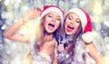 Christmas party. Beauty girls singing Royalty Free Stock Photo