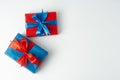 Christmas, party or birthday concept. Blue and red gift boxes isolated over white background. Copy space Royalty Free Stock Photo