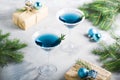 Christmas party composition with drinks gift boxes in blue color