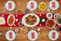 Christmas, party and food with a festive feast on a dinner table in a home from above for celebration. Chicken, event