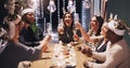 Christmas, party and friends toast with champagne at dinner, lunch and festival celebration together. Social event Royalty Free Stock Photo