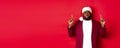 Christmas, party and holidays concept. Miserable and sad african american man pointing fingers up, looking disappointed Royalty Free Stock Photo