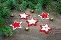 Christmas party preparation background with sewing star figures from red anf white felt, needle with thread, golden bells near fre Royalty Free Stock Photo