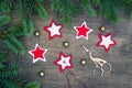 Christmas party preparation background with sewing star figures from red anf white felt, needle with thread, scissors, golden bell Royalty Free Stock Photo