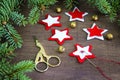 Christmas party preparation background with sewing star figures from red anf white felt, needle with thread, scissors, golden bell Royalty Free Stock Photo