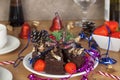 Christmas party table with chocolate cake and strawberrys