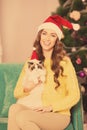 Christmas party, winter holidays woman with cat. New year girl. christmas tree in interior