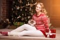 Christmas party, winter holidays woman with cat. New year girl.