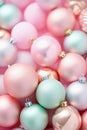 Christmas pastel baubles closeup. Abstract holiday decor background