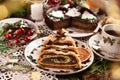 Christmas pastries with poppy seed roll and chocolate cake on festive table Royalty Free Stock Photo