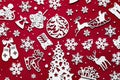 Christmas pattern made of white decorations wooden isolated on red background Royalty Free Stock Photo