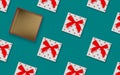 Christmas pattern made of boxes with bow on blue aquamarine, open gift concept, flat lay Royalty Free Stock Photo