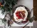 Christmas Pavlova dessert on tabletop. Top view