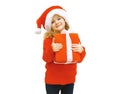 Christmas and people concept - smiling little girl in santa hat Royalty Free Stock Photo