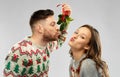 happy couple kissing under the mistletoe